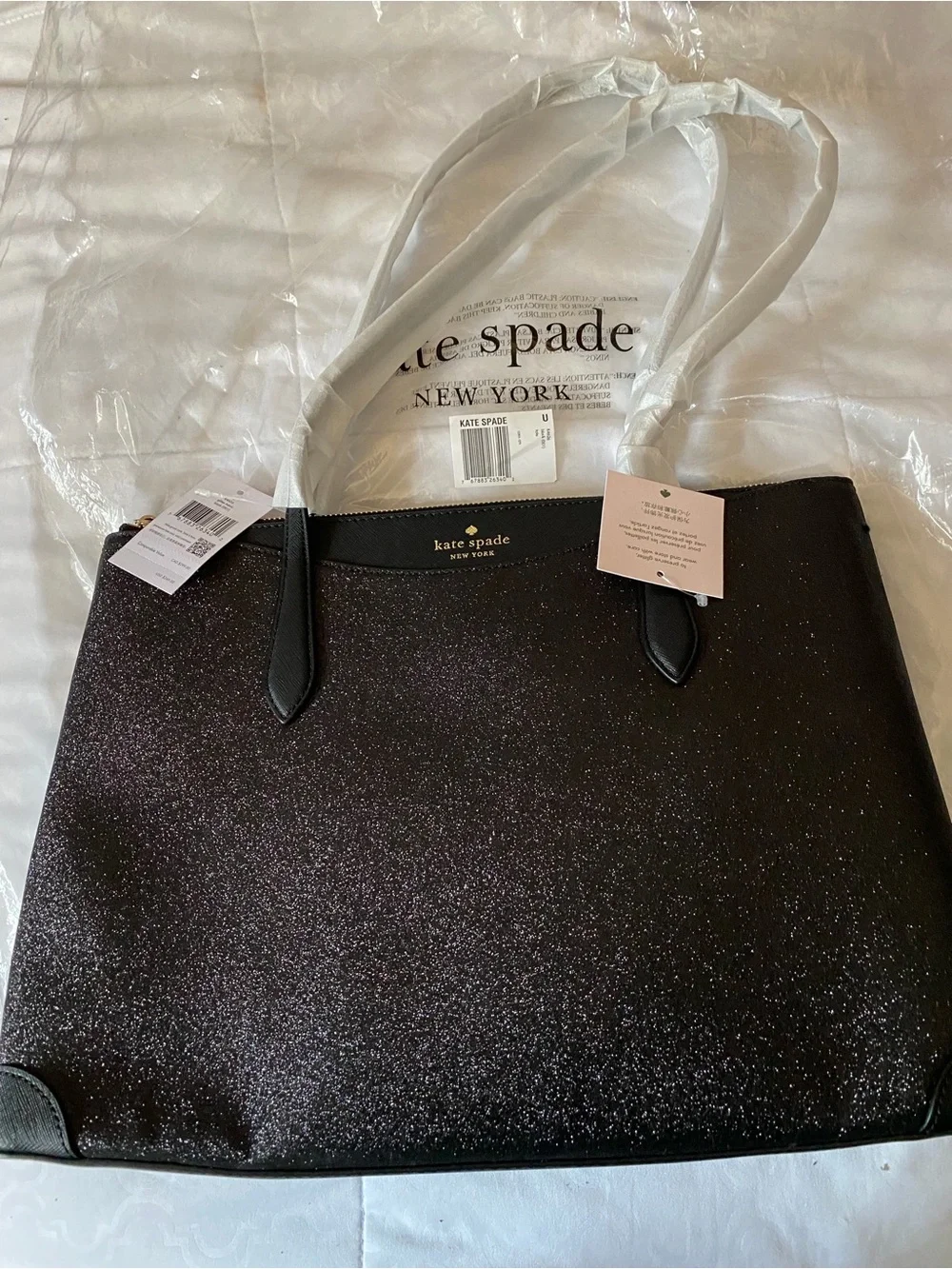 kate spade black glitter tote with gold logo